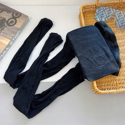 CD fishnet stockings with big D letter